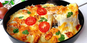 Chicken alongside Potatoes