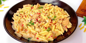 Pasta enveloped in creamy white sauce